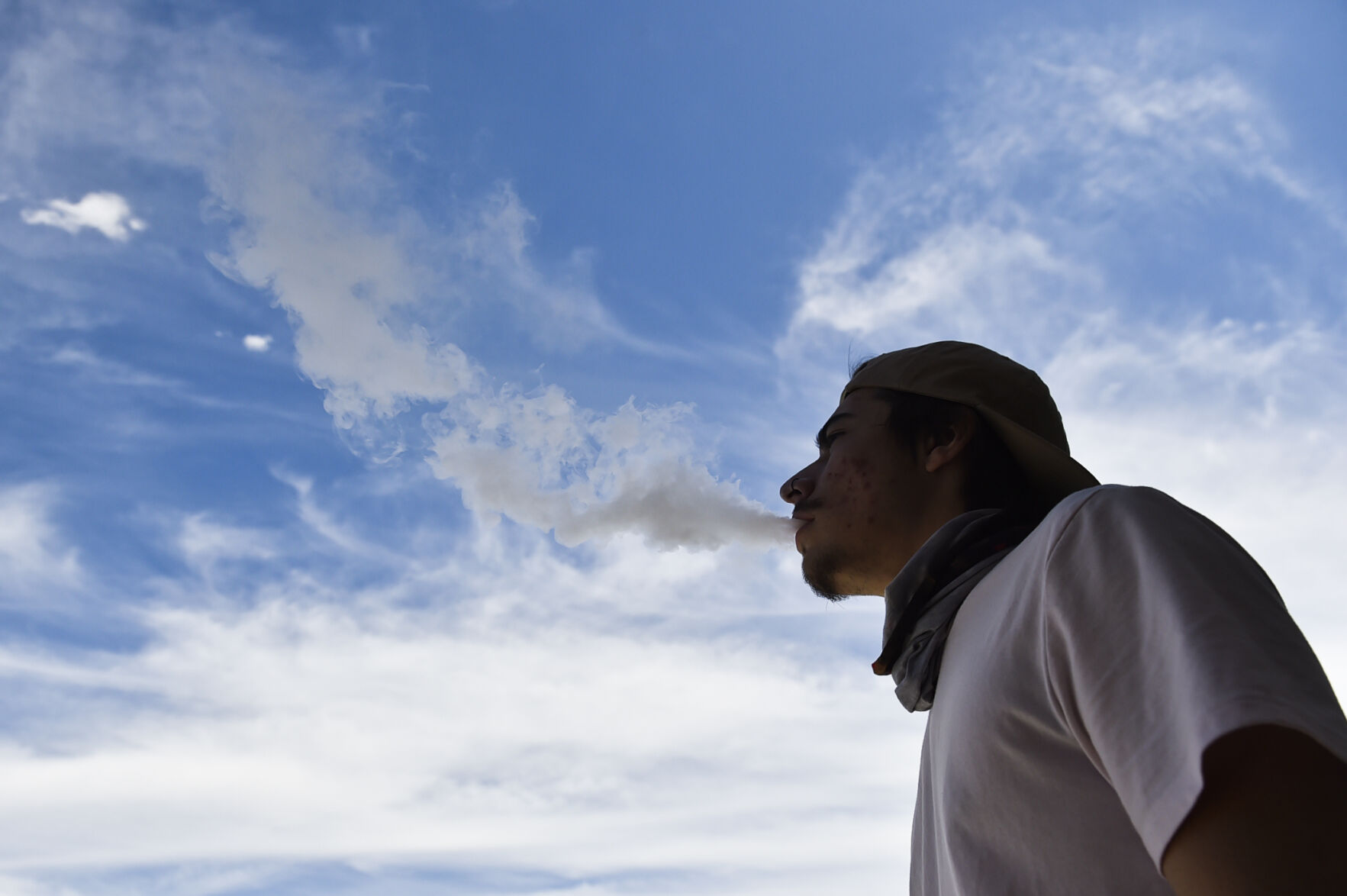 A vaper exhales a cloud of vapor Monday in Helena.